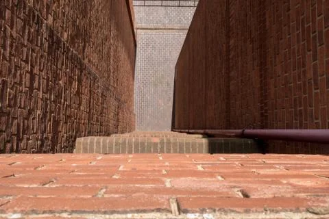 Looking down from the ledge of a tall building to street below Stock Photos