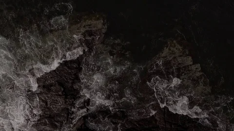 Looking down on Lighthouse and rocks Stock Footage 84744945