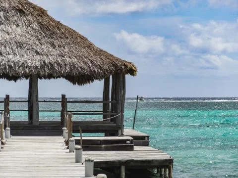 Looking down a long dock on the beach in san pedro Stock Photos