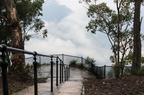 Looking down on mountain lookout on cloudy day Stock Photos