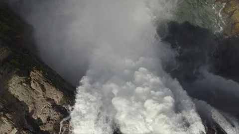 Looking Down a Mountain Waterfall, Drone Stock Footage 99295696