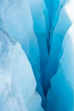 Looking down into multi layered crevasse of blue ice in the Salmon Glacier, C Stock Photos