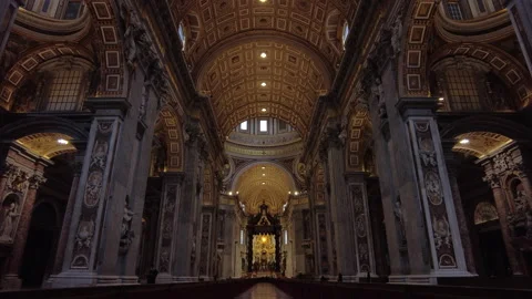 Looking down the nave of St Peter's Basilica in Vatican City, pan up to ceiling. Stock Footage 153265700