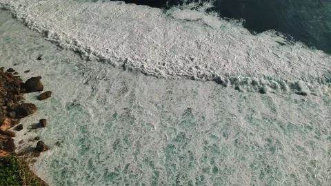Looking down at ocean from steep clifftop on Bali Stock-Footage 145855130