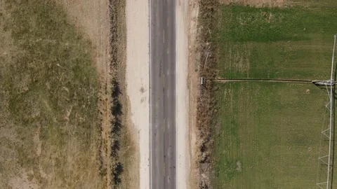 Looking down on an old road in the country from a drone Stock Footage 144298681