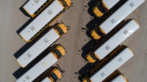 Looking down over a row of school bus Stock Photos