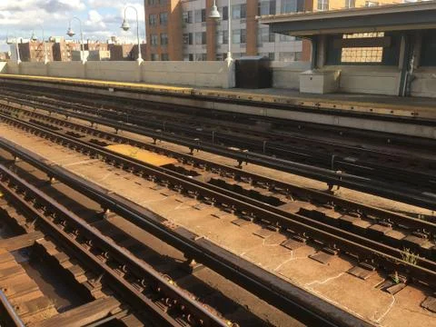 Looking down the overground train tracks at an empty subway platform in Queen Stock Photos