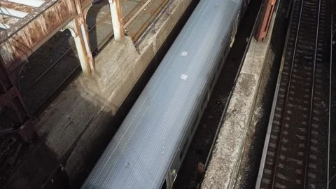 Looking down on a passing commuter train Stock Footage 164321108