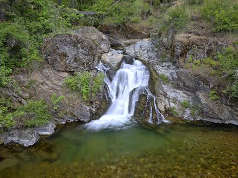 Looking down at a picturesque waterfalls. Stock Photos