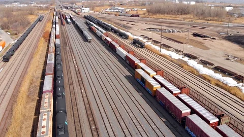 Looking down on railroad rail yard, many trains, tracks Stock Footage 89141579