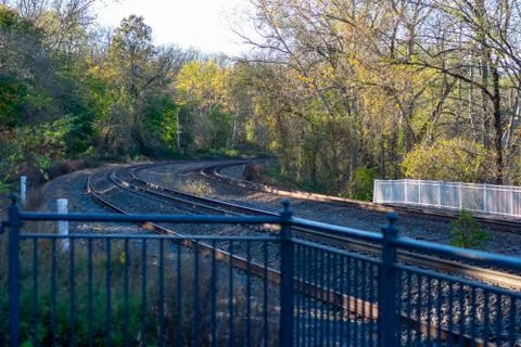 Looking Down Railroad Tracks at Sunset on a Clear Autumn Day Stock Photos