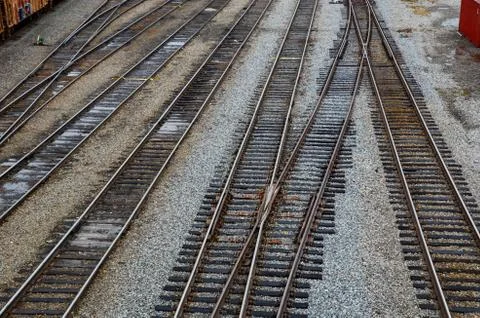 Looking down on the railroad tracks in a train yard. Stock Photos