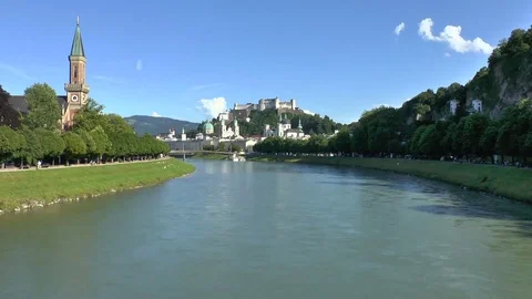 Looking down the river from the bridge at the city in Salzburg Austria Video stock 93783158