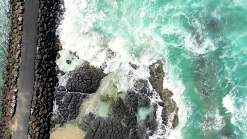 Looking down at the rock wall adjacent to the Cudgen Headland near Stock Footage 273439681