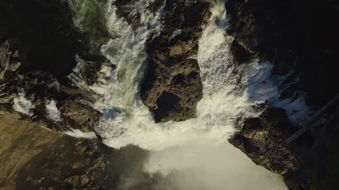 Looking Down a Rocky Waterfall, Drone Stock Footage 99295550