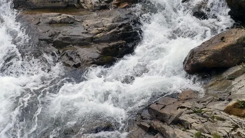 Looking down onto rushing waterfall Stock Footage 93800206