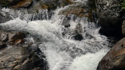 Looking down onto rushing waterfall Stock Footage 93800649
