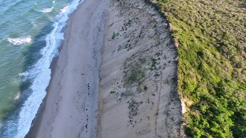 Looking down at the sand dunes and Cahoon Beach on the Atlantic Ocean at Cape Co Video stock 269980981