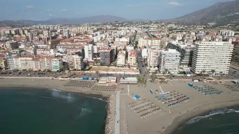 Looking down at the sea and panning up over a seaside town Stock Footage 232982831