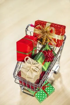 Looking down on a shopping cart full of wrapped gifts Foto stock