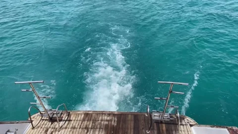 Looking down the side of a boat as it travel fast through the water. White .. Stock-Footage 314395433