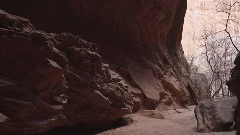 Looking down slot canyon from cave wall, Escalate Utah, slow motion reveal Stock Footage 248582842
