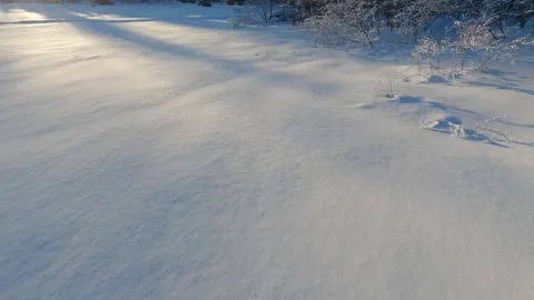 Looking down at the snow while snowshoeing through deep fresh powder snow Stock Footage 299610521
