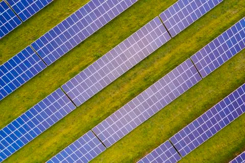 Looking down on to solar panels at sunrise Stock Photos