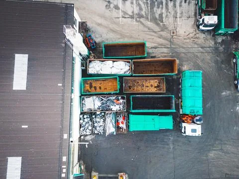 Looking down at sorting containers for different garbage recycling materials Stock Photos