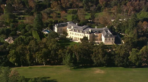 Looking down onto Spelling Manor in Beverly Hills Stock Footage 59544392