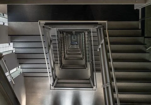 Looking down into the Square shaped Spiral staircase inside of Centre for C.. Stock Photos