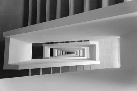 Looking down stairway rectangular spiral Stock Photos
