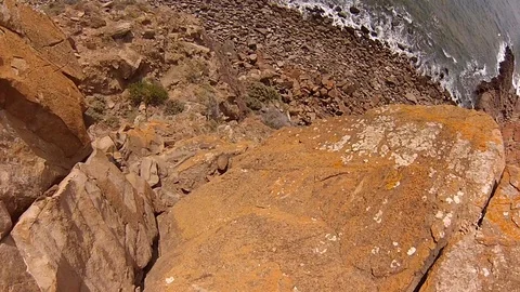 Looking down a steep cliff Video stock 94163793