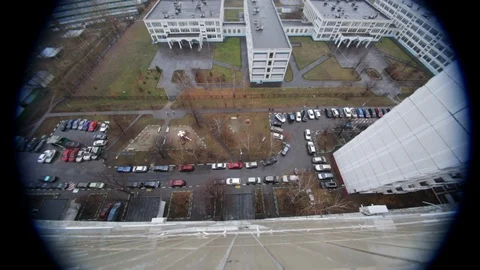 Looking down on to street below from the top of a Moscow apartment building Stock-Footage 107632513