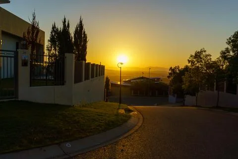 Looking Down a street with a view at sunset Stock Photos