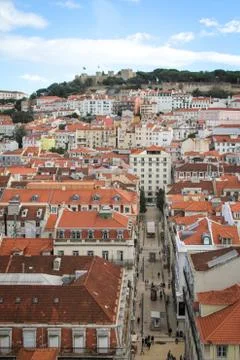 Looking down on the streets and roofs under a mountain in birds-eye-view.	 Stock Photos