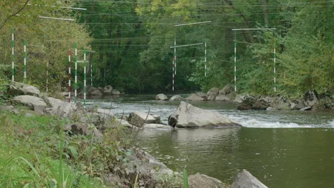 Looking down a stretch of the Vire river where kayaking is popular. 4K tripod Stock Footage 141369578