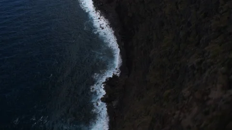 Looking down on surf below Molokai's coastal cliffs. Shot in 2010. Stock Footage 59523448