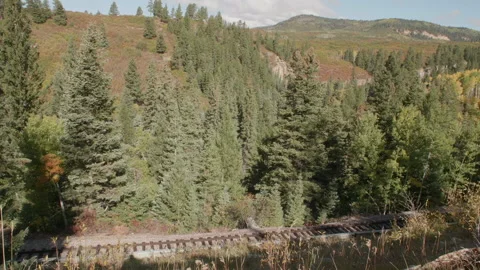 Looking Down at theChama Cumbres and Toltec Steam Train Passing By Stock Footage 188185744