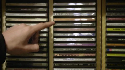 Looking Down Through CDs at Flea Market TILT DOWN Stock Footage 104690474