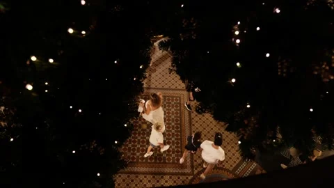 Looking down through Christmas tree at Australian shoppers 6K Video stock 325829932