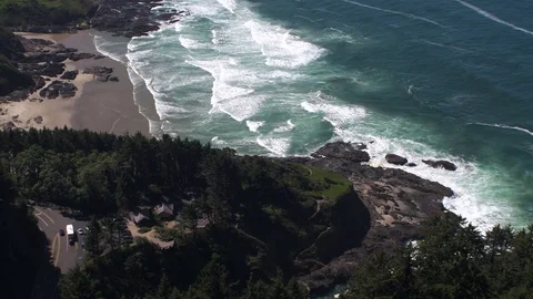 Looking down from the top of Cape Perpetua, tilting up to see the coastline Stock Footage 85449128