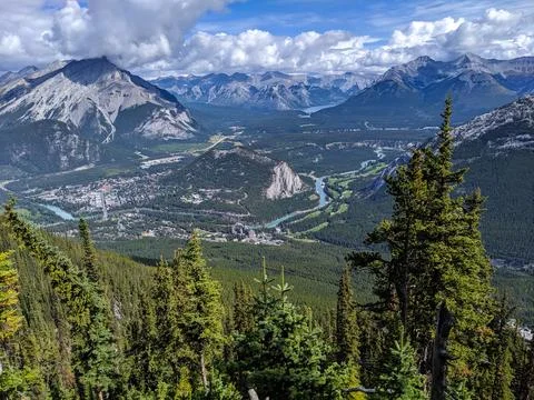 Looking down at the town of Banff from the top of a mountain Stock Photos