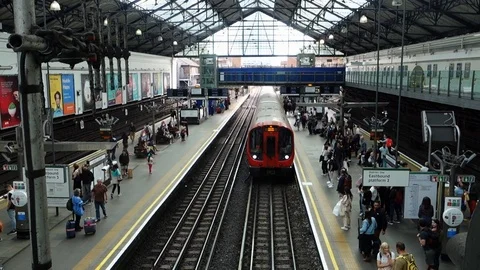 Looking down on a train arriving in Earl's Court London Underground Station. Stock Footage 109345336