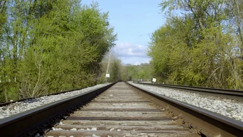 Looking down train tracks. 4k60p Stock Footage 130815068