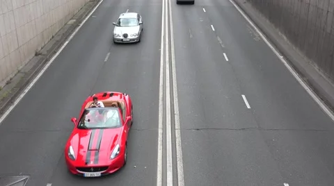 Looking down on vehicles passing on a 4 lane road (in 4k), Paris, France. Stock Footage 53895369