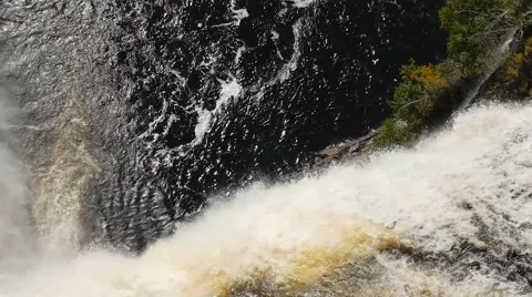 Looking down a very big waterfall as the water rushes to the bottom lake 2 Video stock 62649258