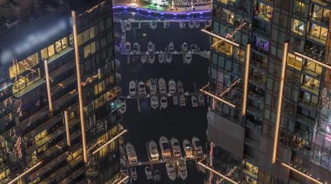 Looking down view perspective on night highlighted luxury Dubai Marina skyscr Stock Photos