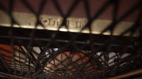 Looking down a vintage elevator shaft as it descends and goes down through Stock Footage 94042054