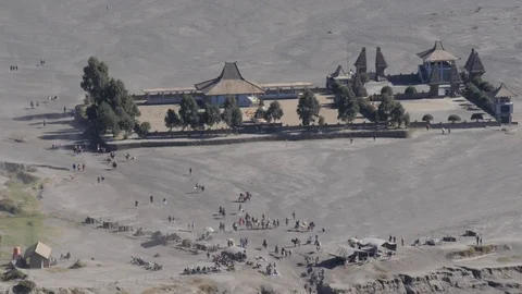 Looking down volcano slope to Hindu temple in Bromo Java Indonesia Stock Footage 82102250